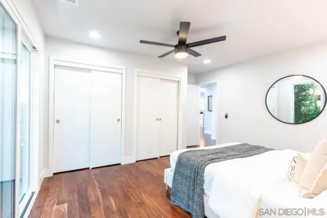 an aerial view of residential houses with city view