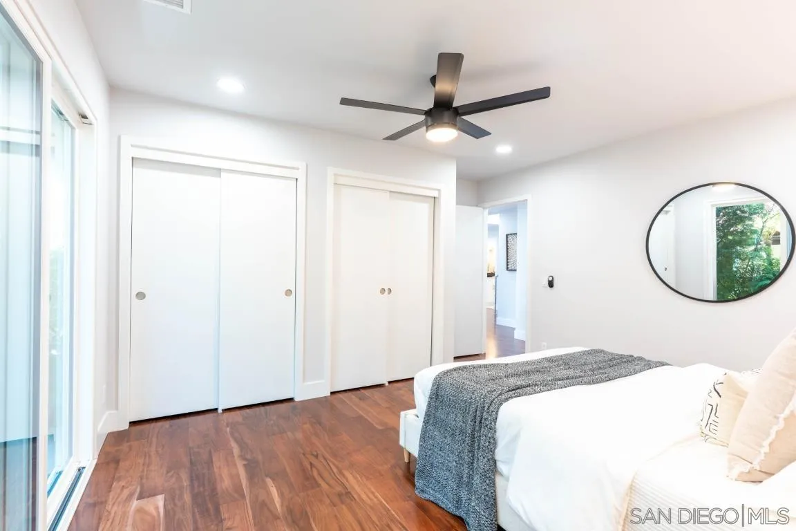 907 Ridge Heights Drive Fallbrook, CA 92028 - Photo 39 of 70 a bedroom with a large bed and a chandelier