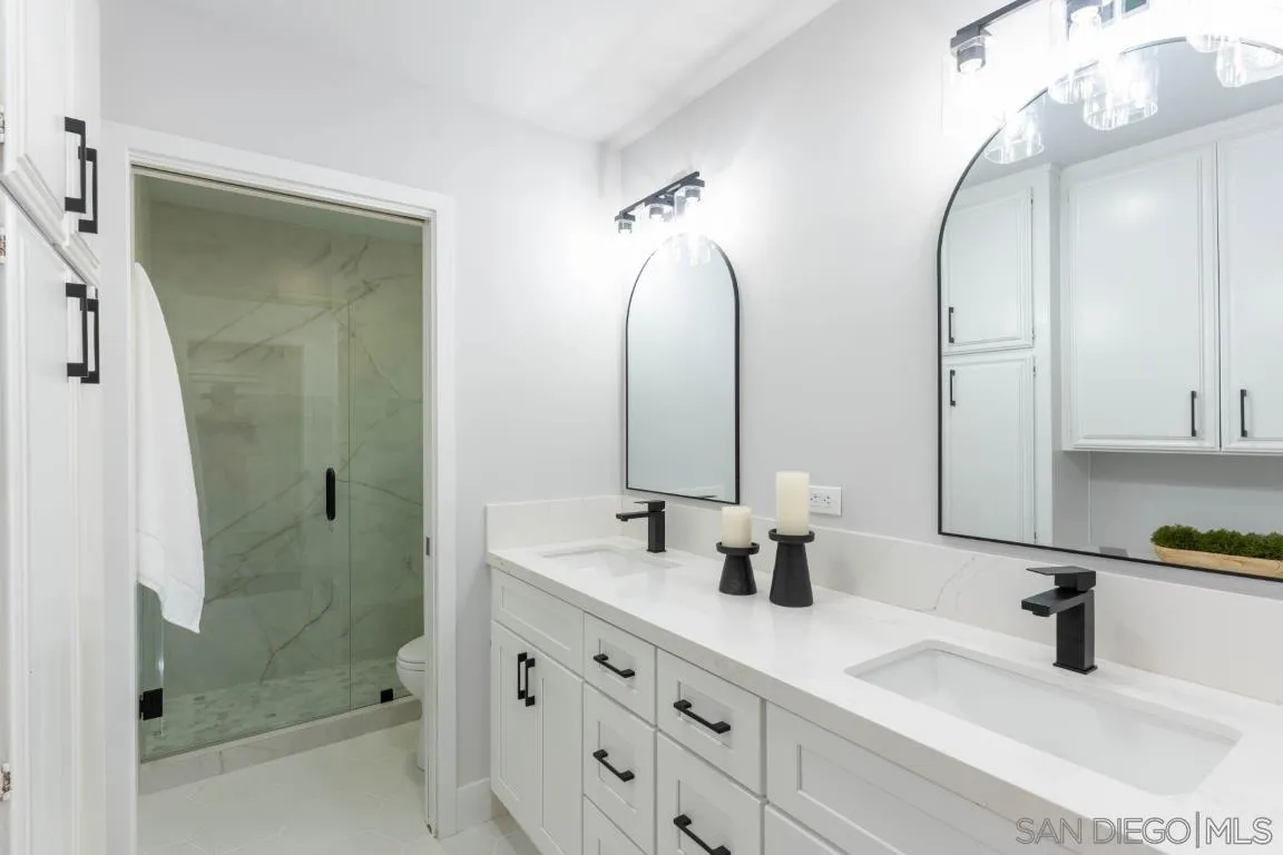907 Ridge Heights Drive Fallbrook, CA 92028 - Photo 40 of 70 a bathroom with a double vanity sink mirror double shower