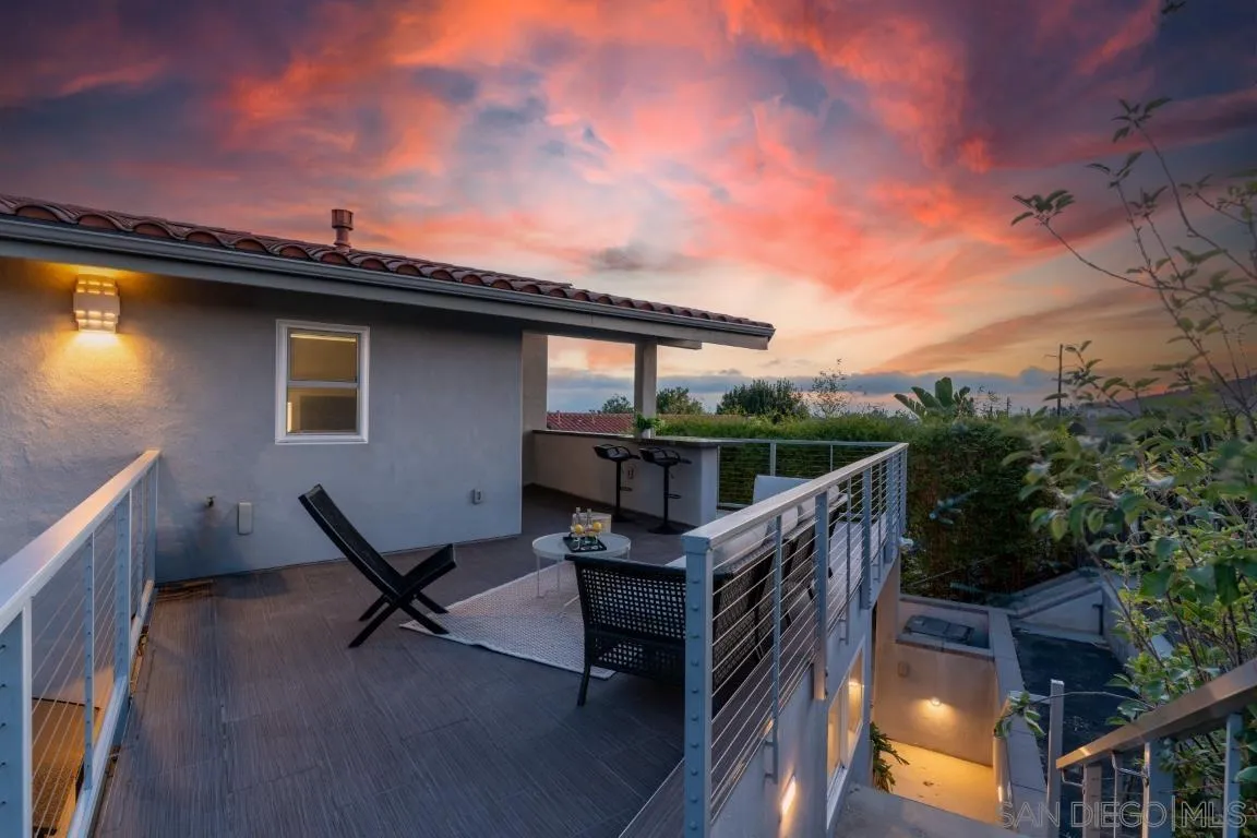 907 Ridge Heights Drive Fallbrook, CA 92028 - Photo 49 of 70 a view of a roof deck with wooden fence and a floor to ceiling window