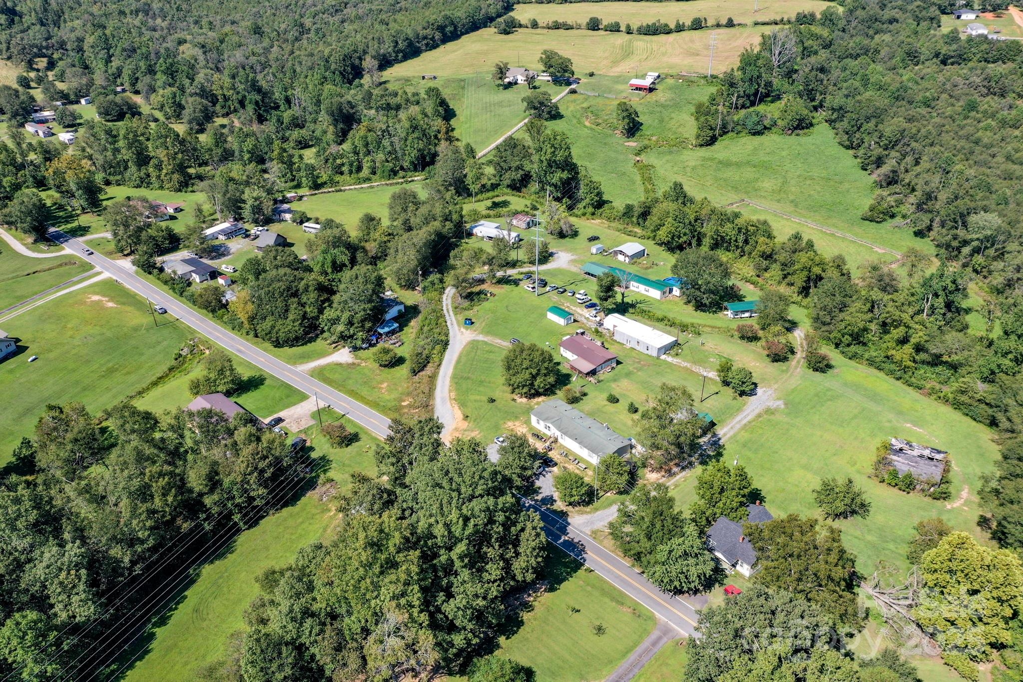 827 Old Henrietta Road Forest City, NC 28043 - Photo 12 of 18 an aerial view of a residential houses with outdoor space and trees all around