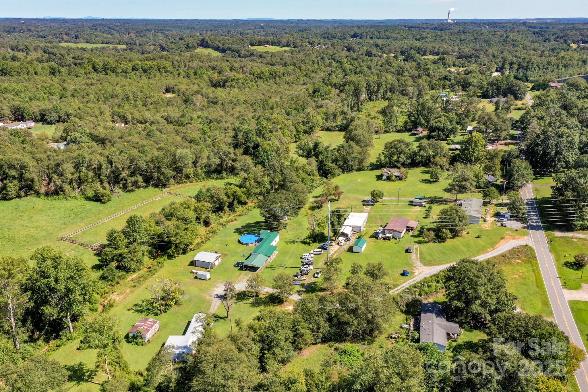 827 Old Henrietta Road Forest City, NC 28043 - Photo 17 of 18 an aerial view of a residential houses with outdoor space and trees