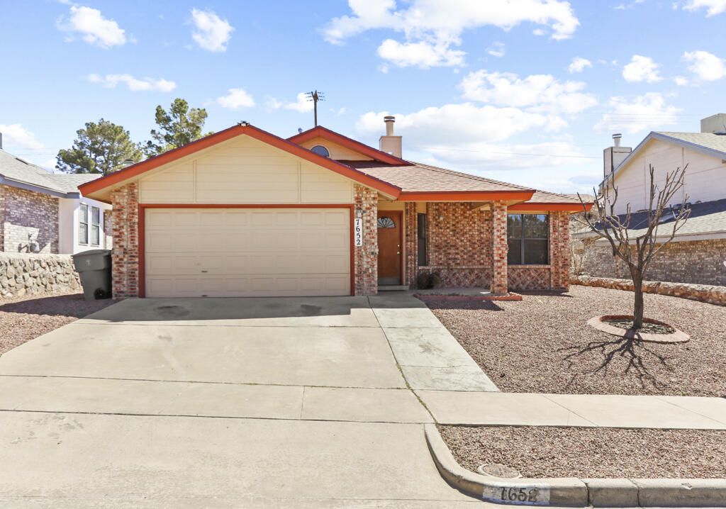 7652 Windcrest Drive El Paso, TX 79912 - Photo 1 of 1 a front view of a house with garden