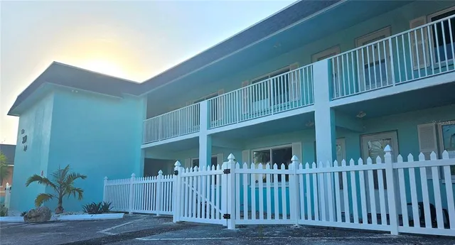 a view of a house with wooden deck