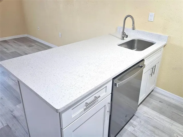 a view of hallway with wooden floor