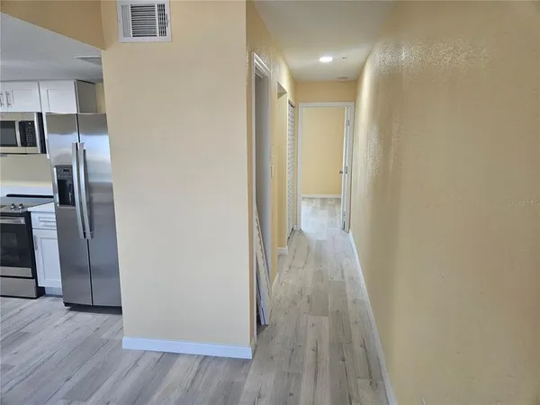 a view of a livingroom with wooden floor