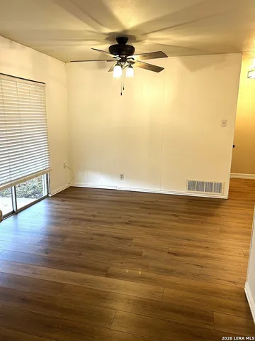 a kitchen with a sink appliances and cabinets