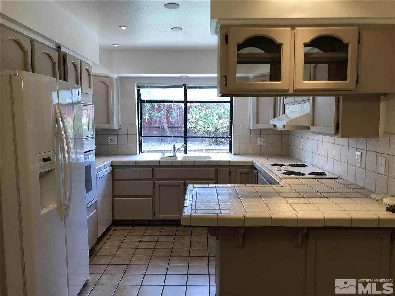 617 James Lane Reno, NV 89503 - Photo 3 of 15 a kitchen with stainless steel appliances a sink stove and refrigerator
