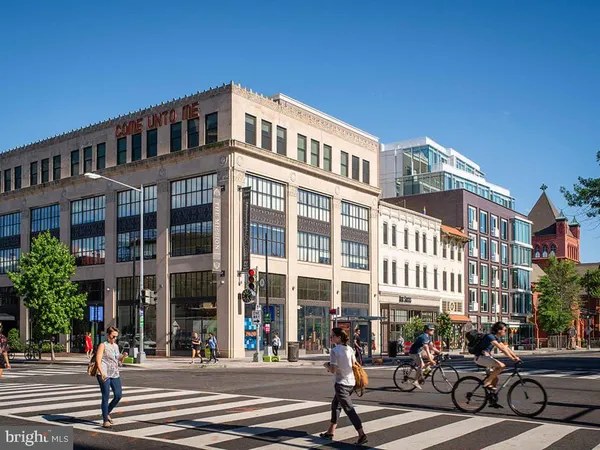 a city street lined with tall buildings