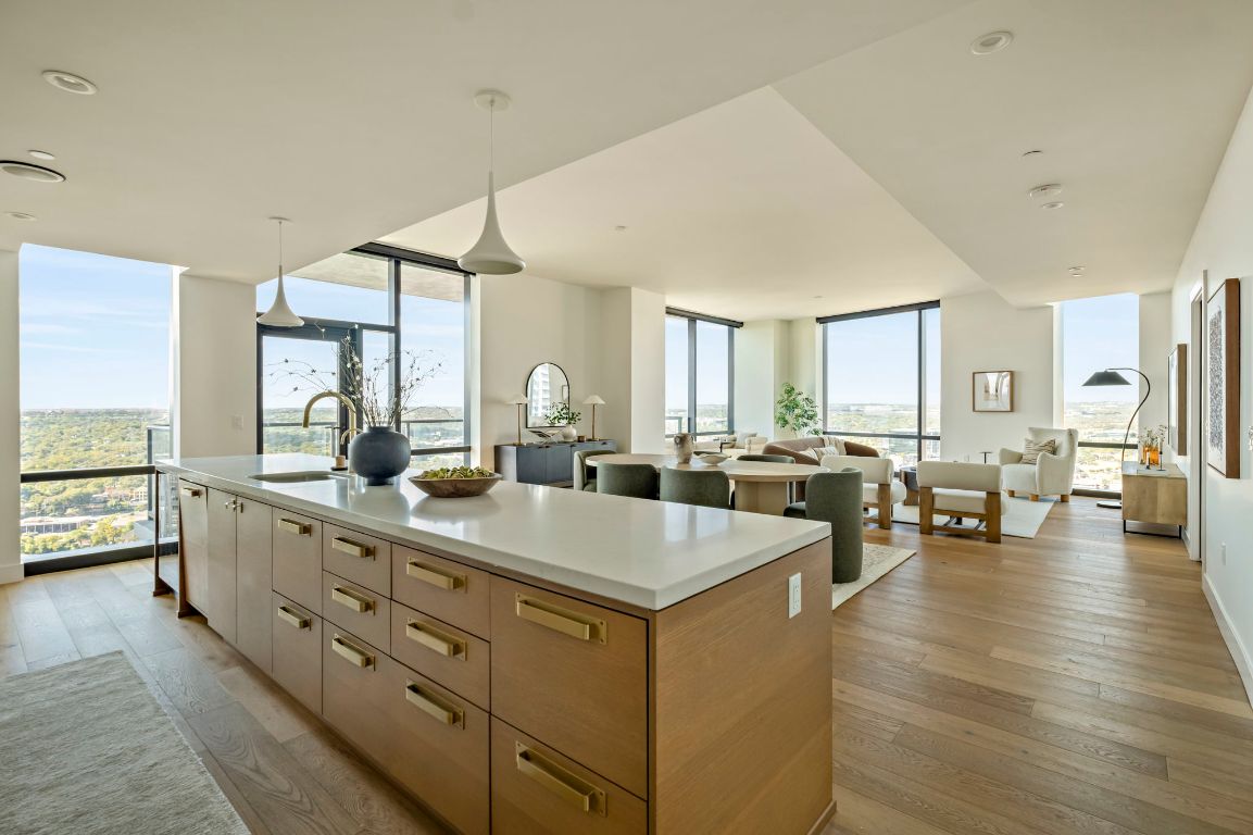70 Rainey Street, Unit 2701 Austin, TX 78701 - Photo 14 of 40 a view of living room with granite countertop lots of white furniture