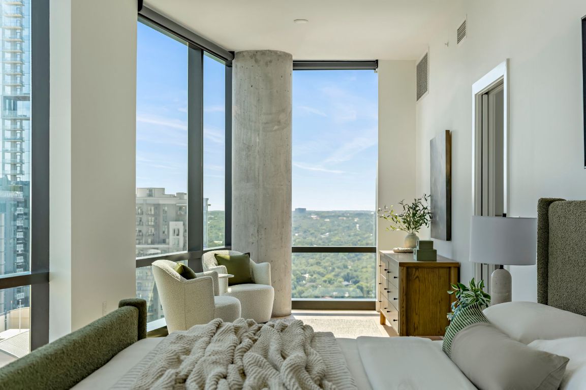 70 Rainey Street, Unit 2701 Austin, TX 78701 - Photo 17 of 40 a living room with furniture and a floor to ceiling window
