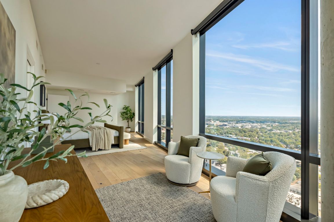 70 Rainey Street, Unit 2701 Austin, TX 78701 - Photo 18 of 40 a living room with furniture and a floor to ceiling window