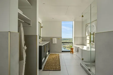 a walk in closet with a couch