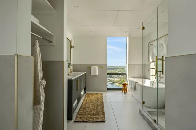 a walk in closet with a couch