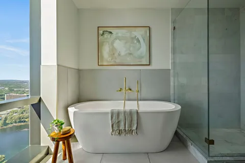 a white bath tub sitting in a bathroom