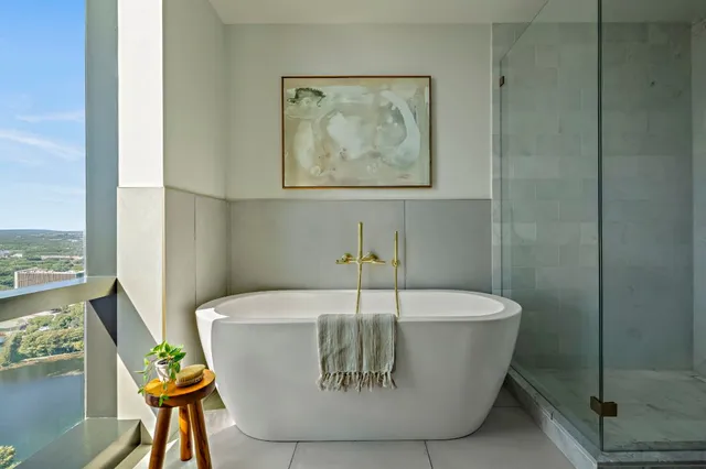 a white bath tub sitting in a bathroom