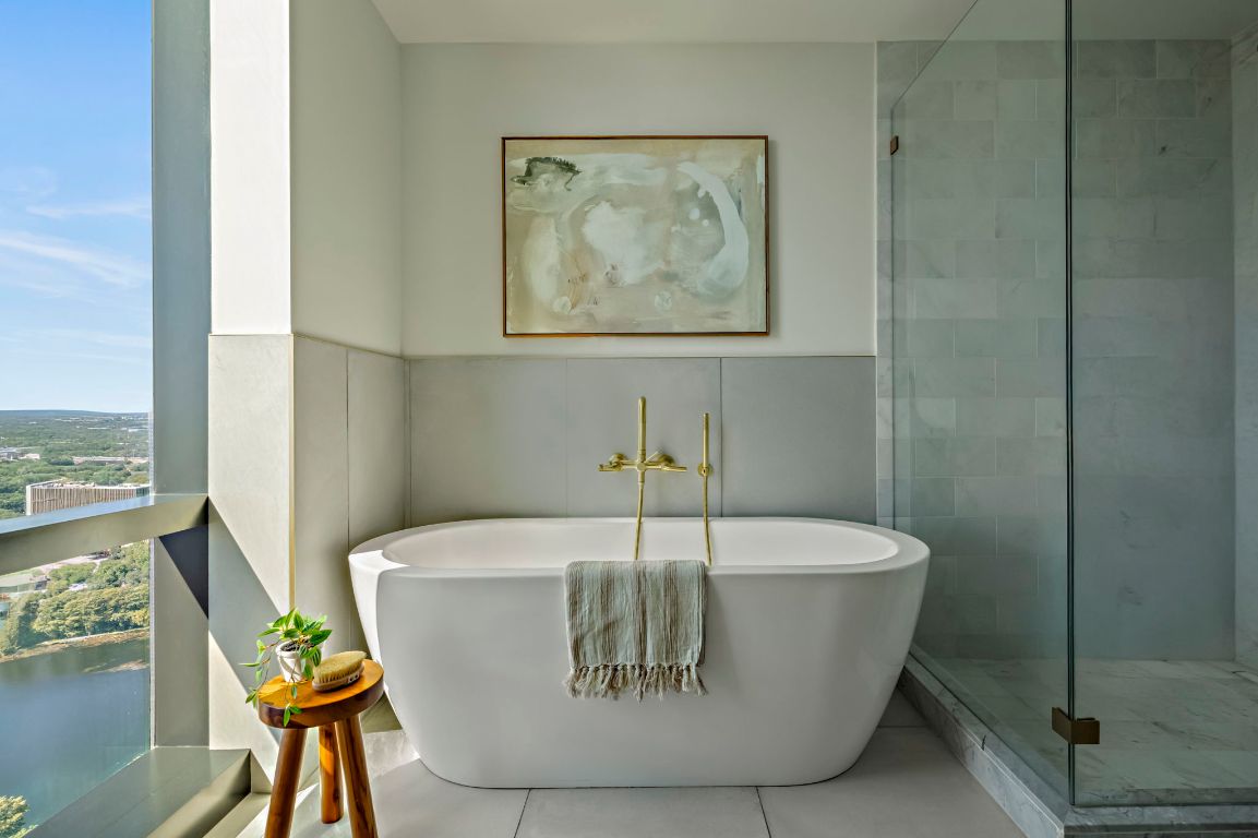 70 Rainey Street, Unit 2701 Austin, TX 78701 - Photo 21 of 40 a white bath tub sitting in a bathroom