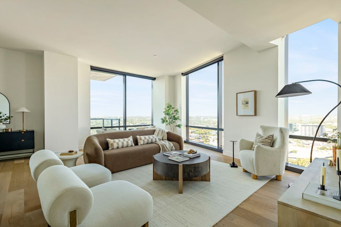 70 Rainey Street, Unit 2701 Austin, TX 78701 - Photo 3 of 40 a living room with furniture and a large window