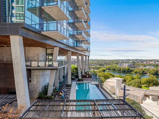 a view of a balcony with seating area