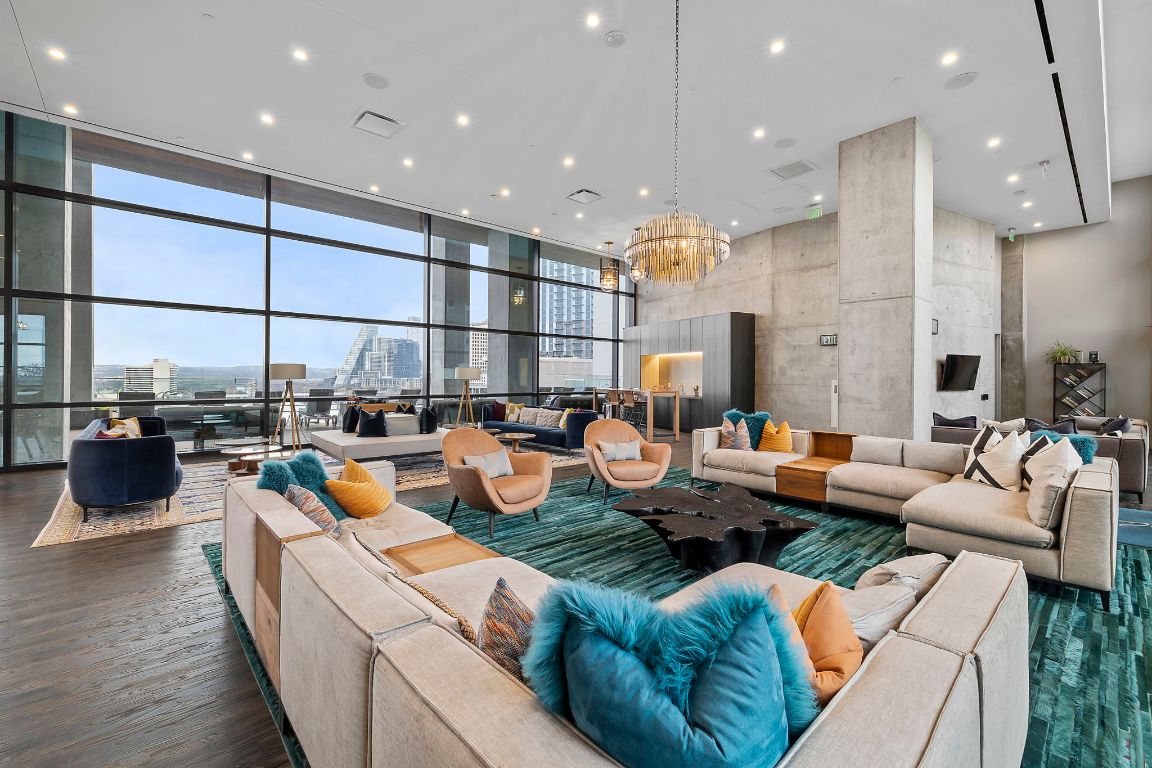 70 Rainey Street, Unit 2701 Austin, TX 78701 - Photo 36 of 40 a living room with lots of furniture and kitchen view