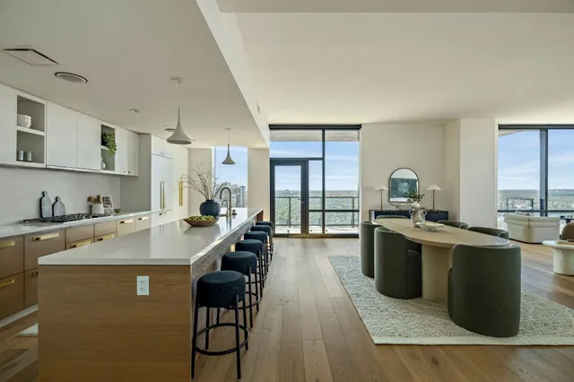 a kitchen with a sink appliances and cabinets