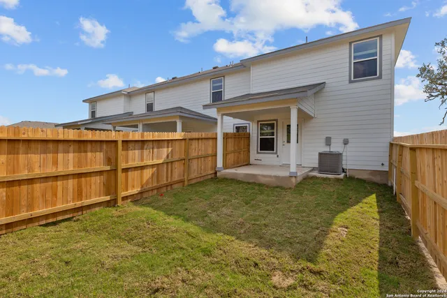 a view of house with outdoor space and garden