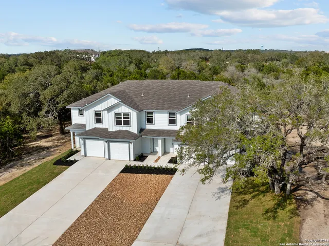 a view of house with outdoor space and tree s