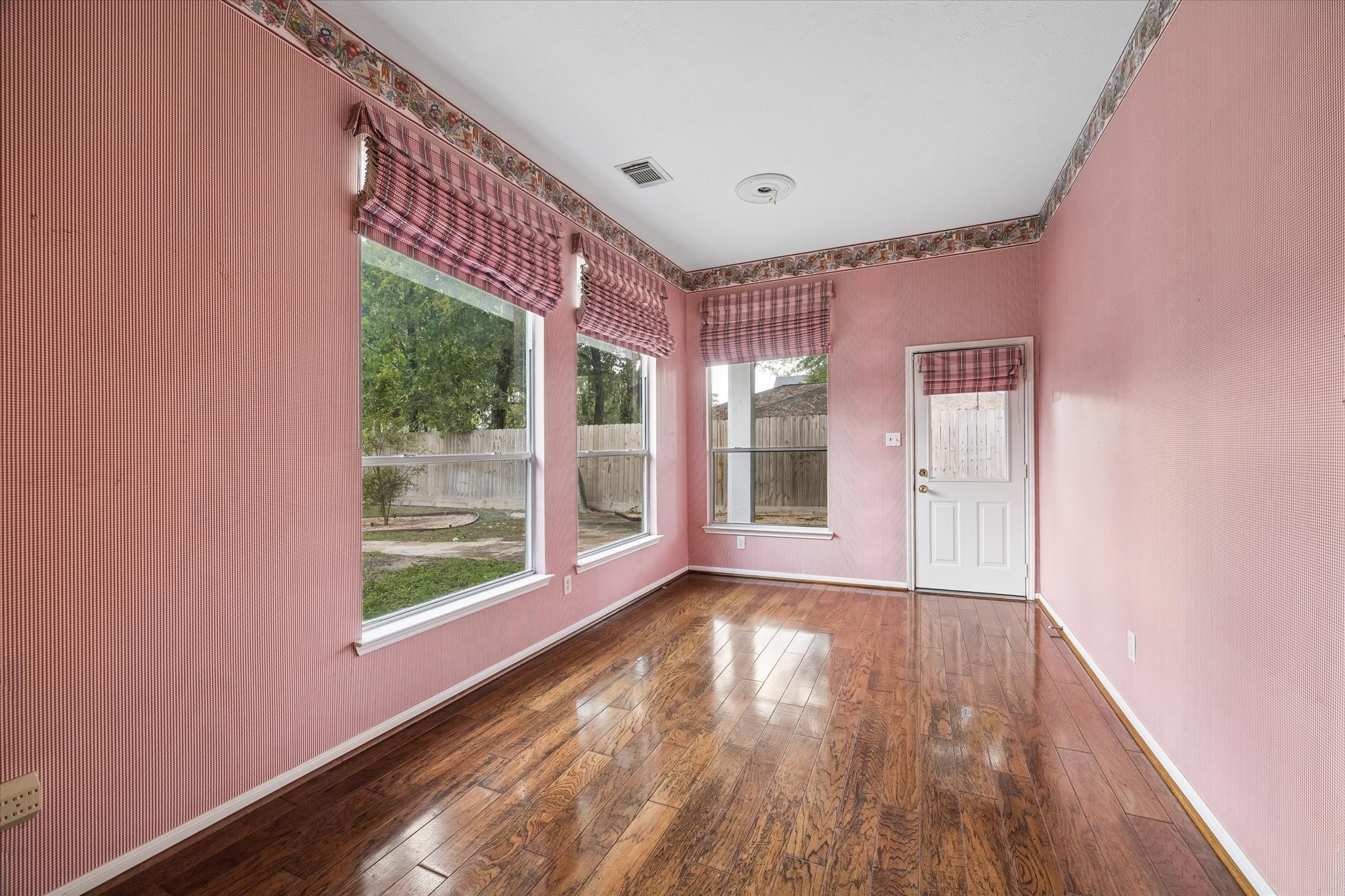 1203 Bingle Road Houston, TX 77055 - Photo 10 of 21 Breakfast room featuring large windows that offer natural light and a view of the backyard.