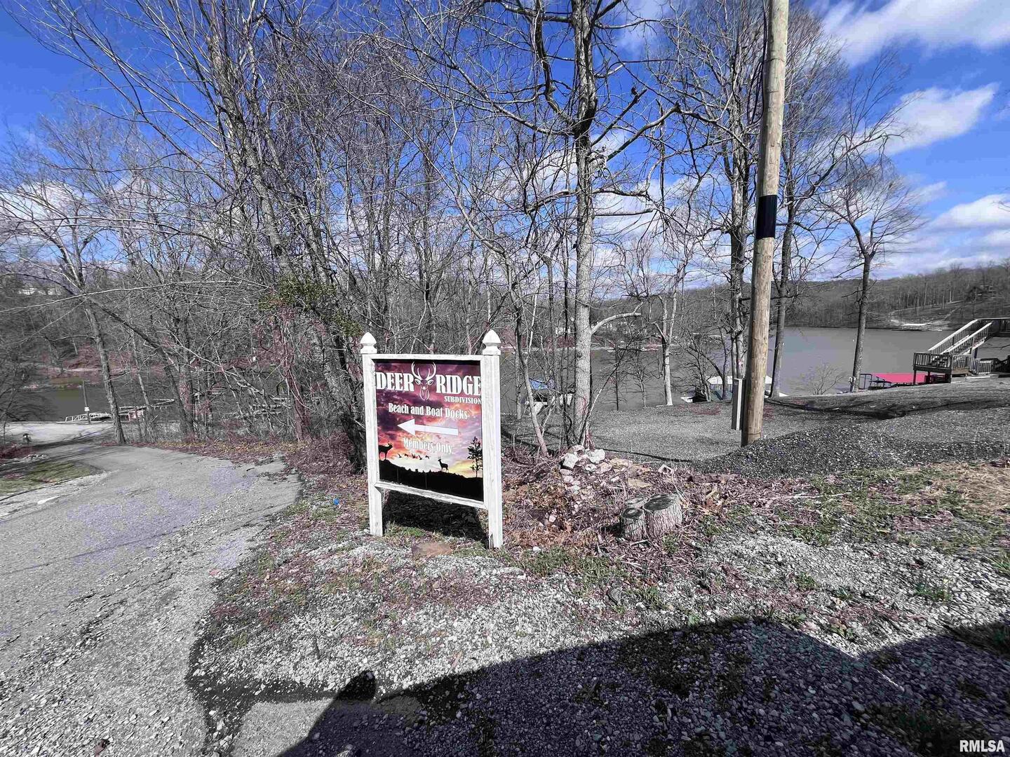 0 Deer Ridge Road Goreville, IL 62939 - Photo 12 of 18 a sign that is sitting in front of a road with a house