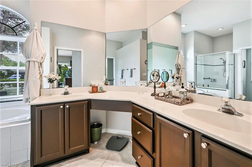 6545 Chestnut Circle Naples, FL 34109 - Photo 20 of 43 a bathroom with a sink double vanity and a mirror