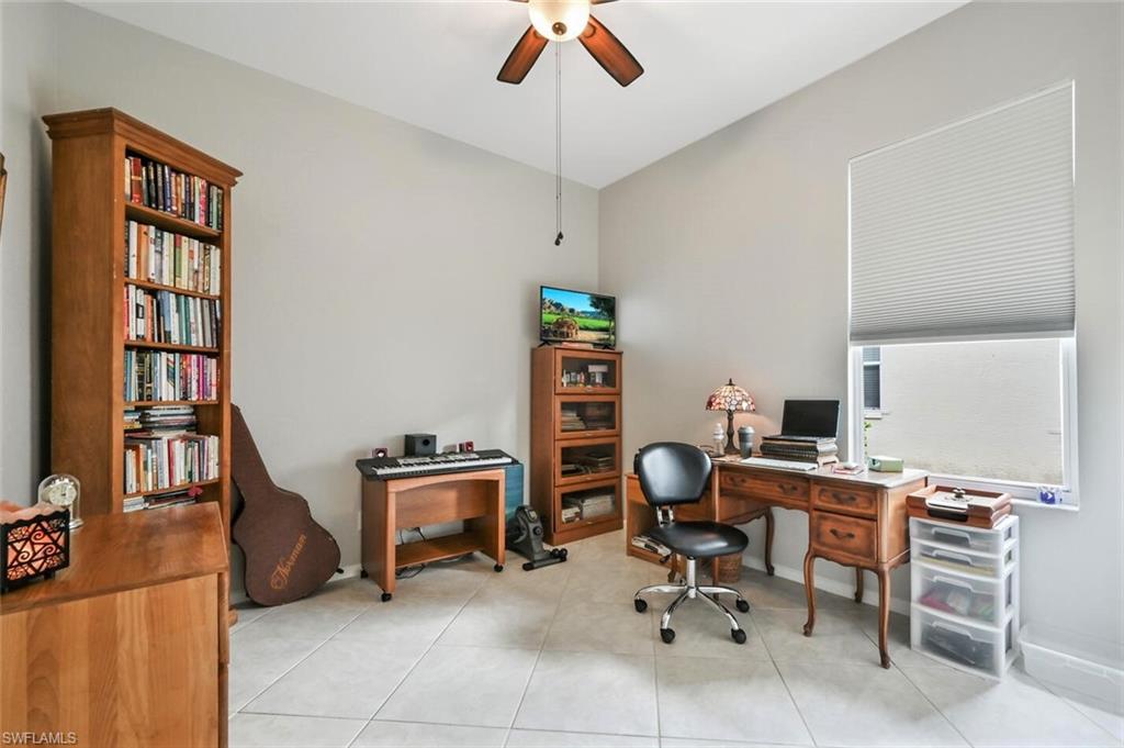 6545 Chestnut Circle Naples, FL 34109 - Photo 26 of 43 a view of a workspace with furniture and a window