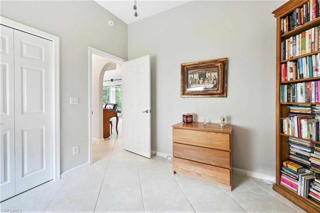 6545 Chestnut Circle Naples, FL 34109 - Photo 27 of 43 a view of a bedroom with furniture and closet