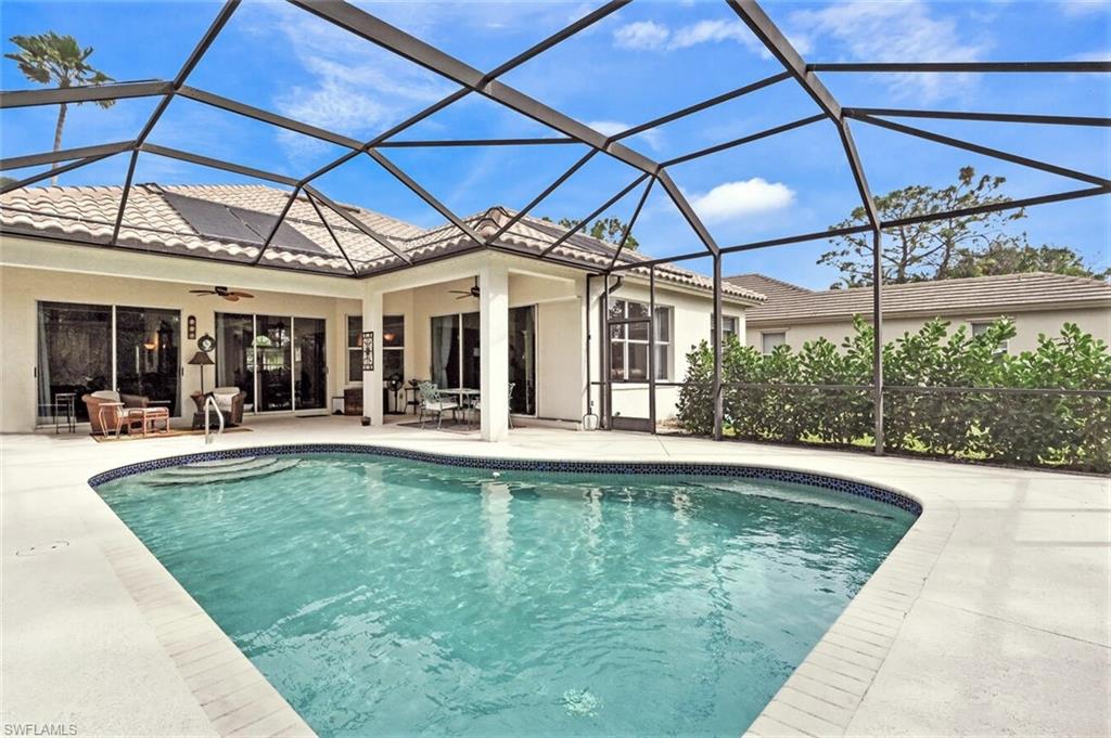6545 Chestnut Circle Naples, FL 34109 - Photo 29 of 43 a view of a swimming pool with a patio