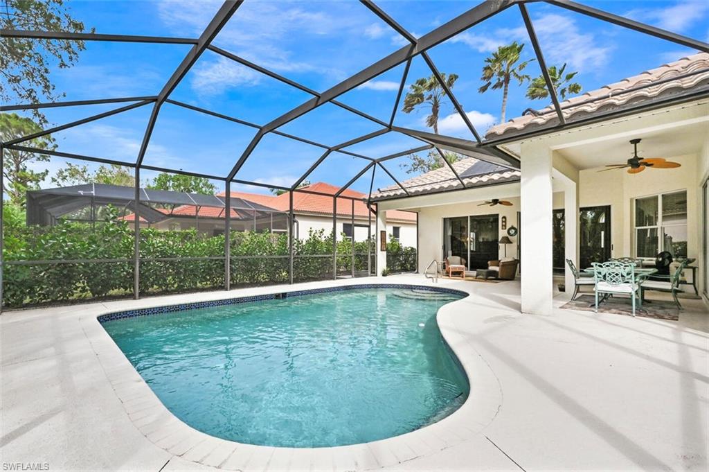 6545 Chestnut Circle Naples, FL 34109 - Photo 35 of 43 a view of a swimming pool with a patio