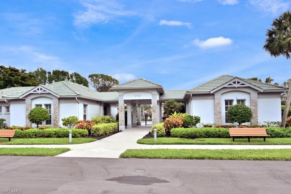 6545 Chestnut Circle Naples, FL 34109 - Photo 36 of 43 a front view of a house with a yard