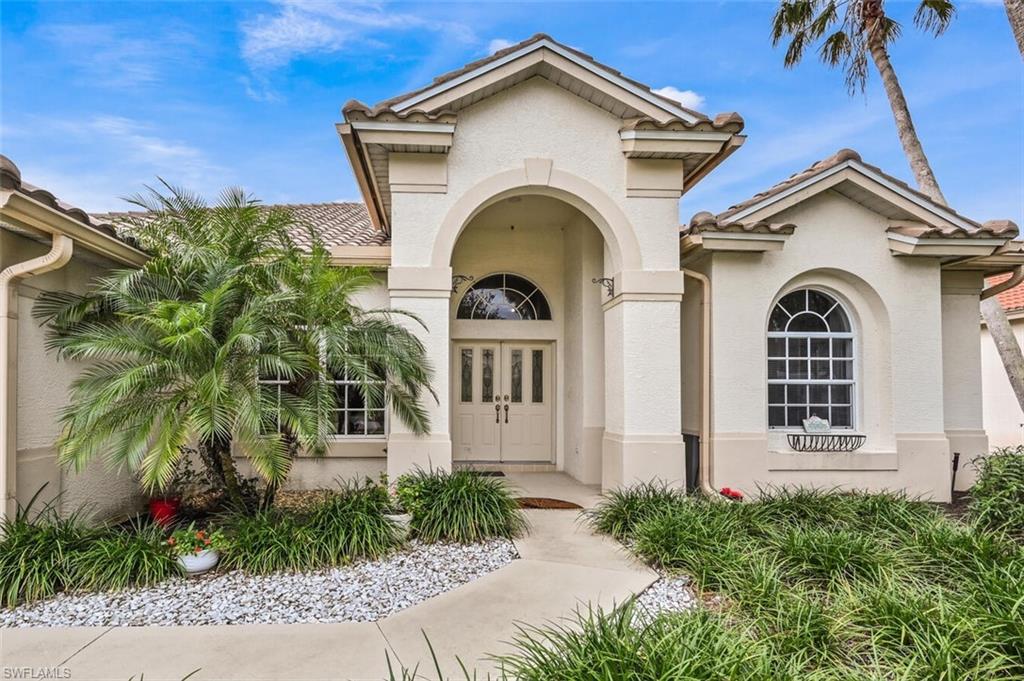 6545 Chestnut Circle Naples, FL 34109 - Photo 4 of 43 a view of white house with a outdoor space