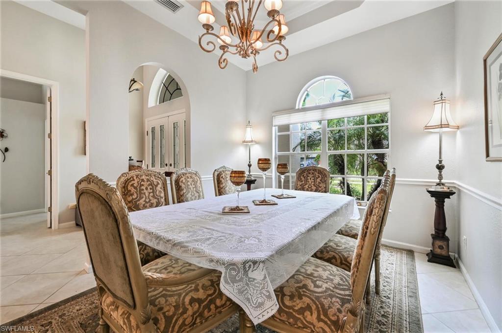 6545 Chestnut Circle Naples, FL 34109 - Photo 9 of 43 a view of a dining room with furniture window and outside view