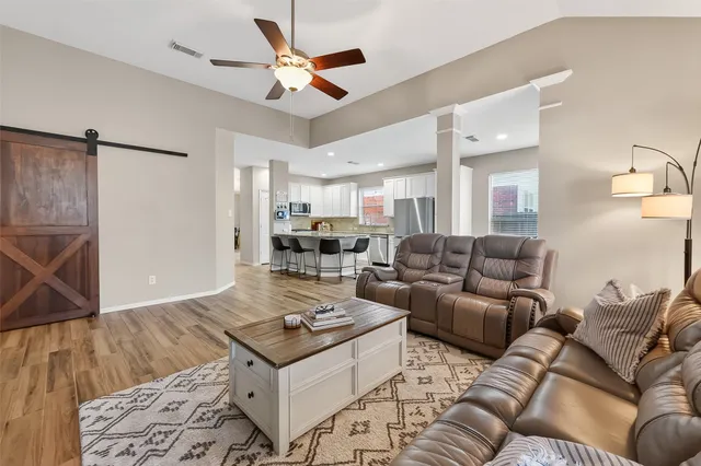 a living room with furniture and a rug