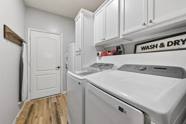 a utility room with dryer and washer