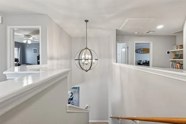 a very nice looking room with a large window and chandelier