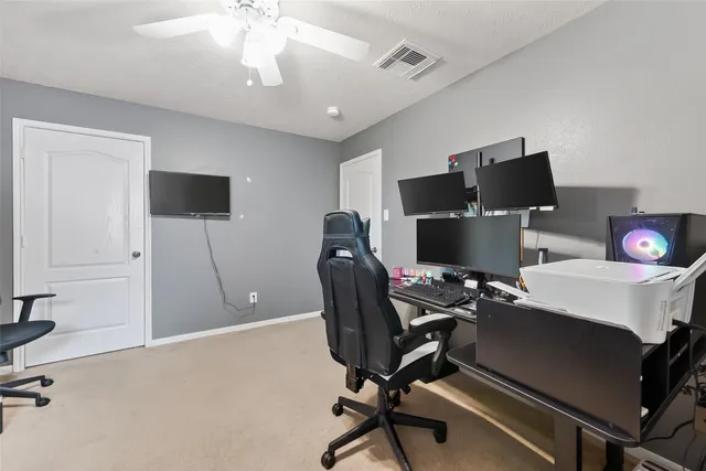 a workspace with furniture and wooden floor