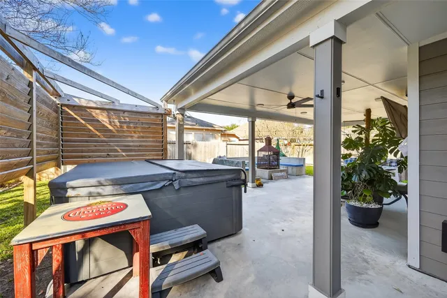 a view of a chairs and table in a patio