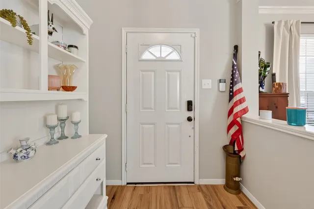 a view of an entryway with wooden floor
