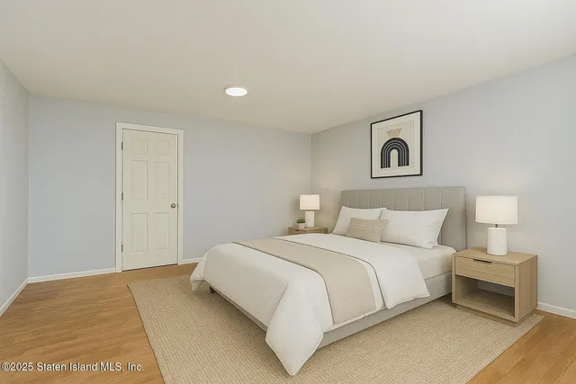 a green field with trees in front of it