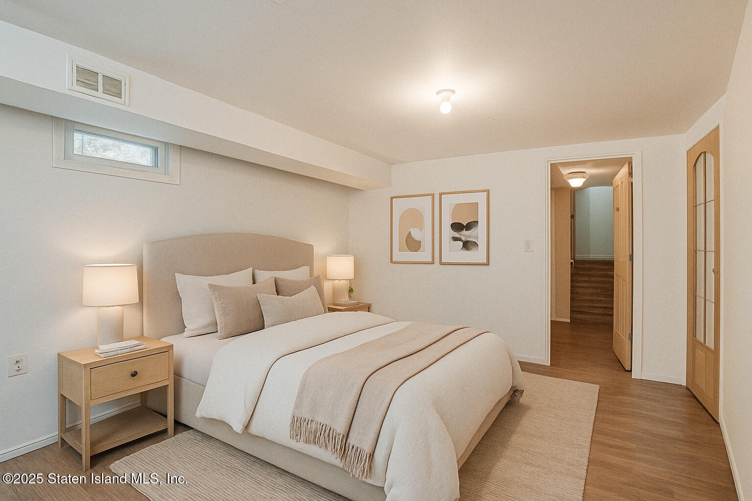 318 Travis Avenue Staten Island, NY 10314 - Photo 19 of 24 a bedroom with a bed and a night stand