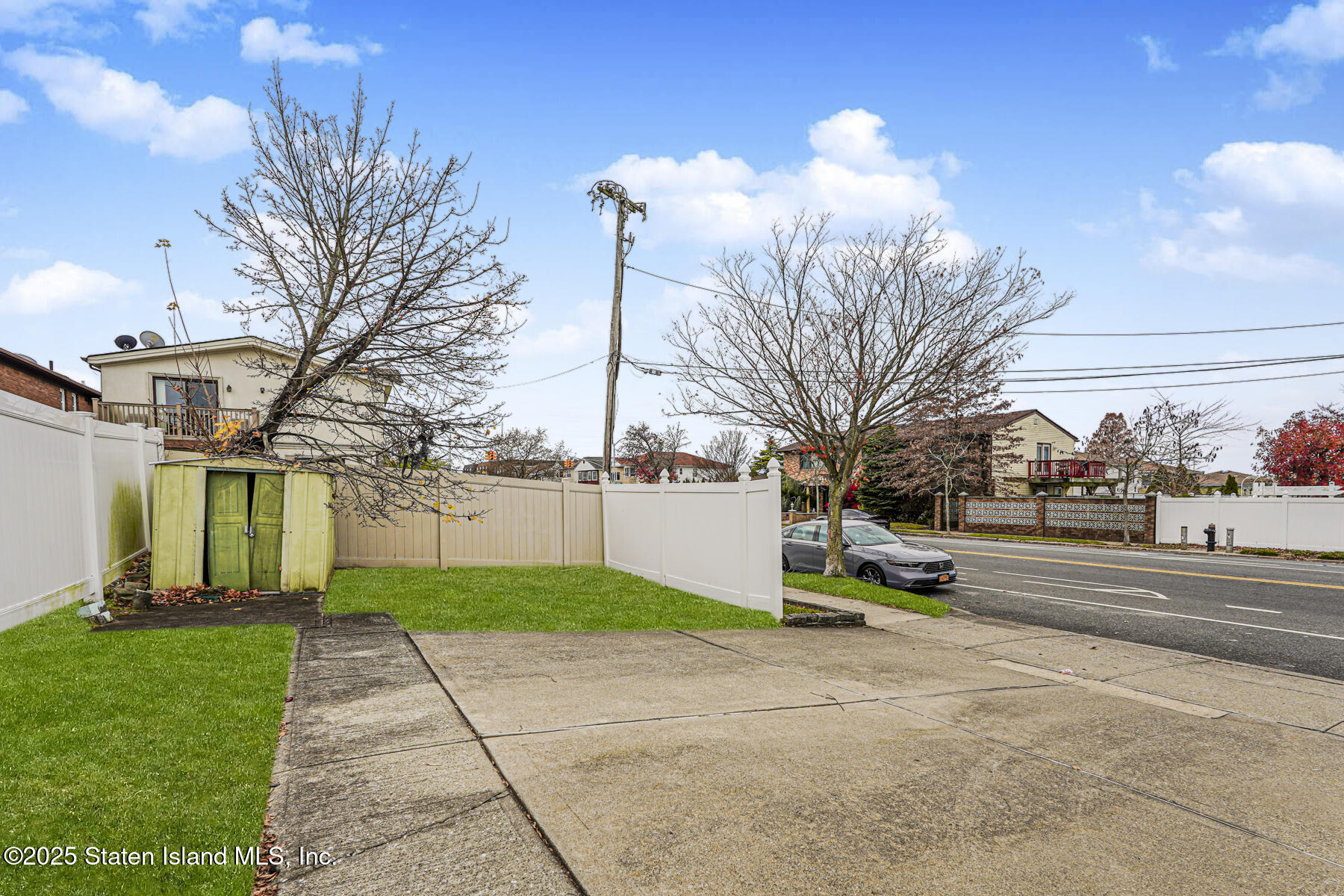 318 Travis Avenue Staten Island, NY 10314 - Photo 23 of 24 a green field with trees in front of it