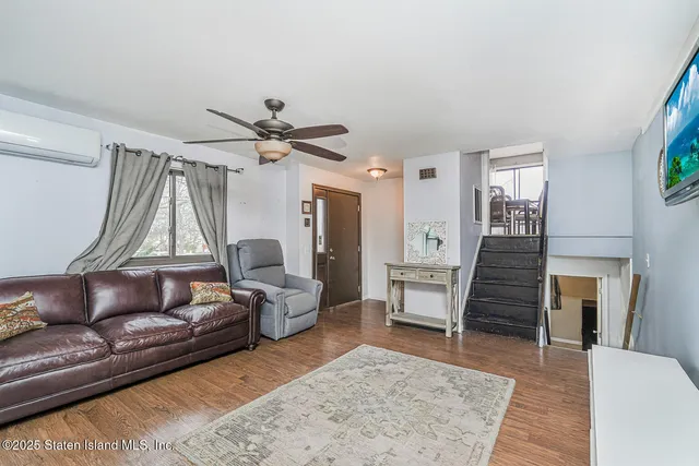 a kitchen with stainless steel appliances granite countertop a refrigerator a stove a sink dishwasher and a refrigerator