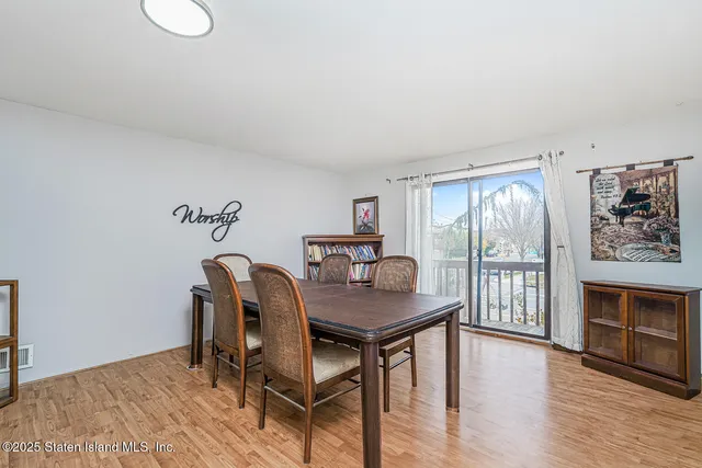 a bedroom with a bed and a night stand