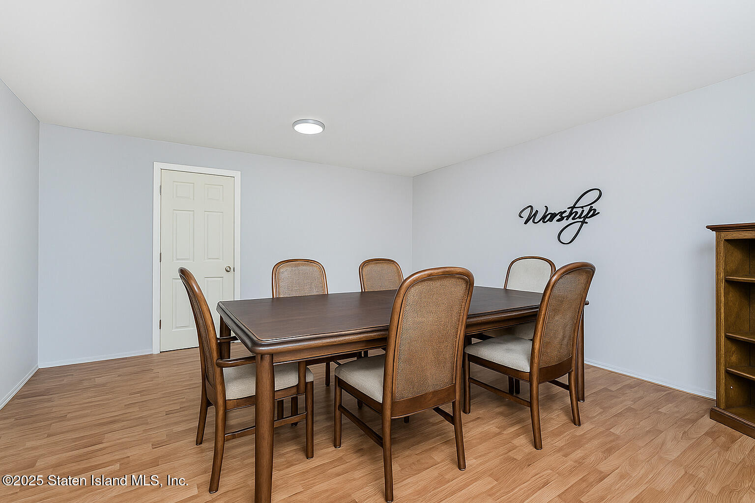 318 Travis Avenue Staten Island, NY 10314 - Photo 10 of 24 a view of a dining room with furniture and wooden floor