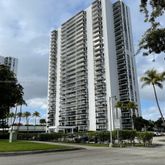 a front view of a building with glass windows